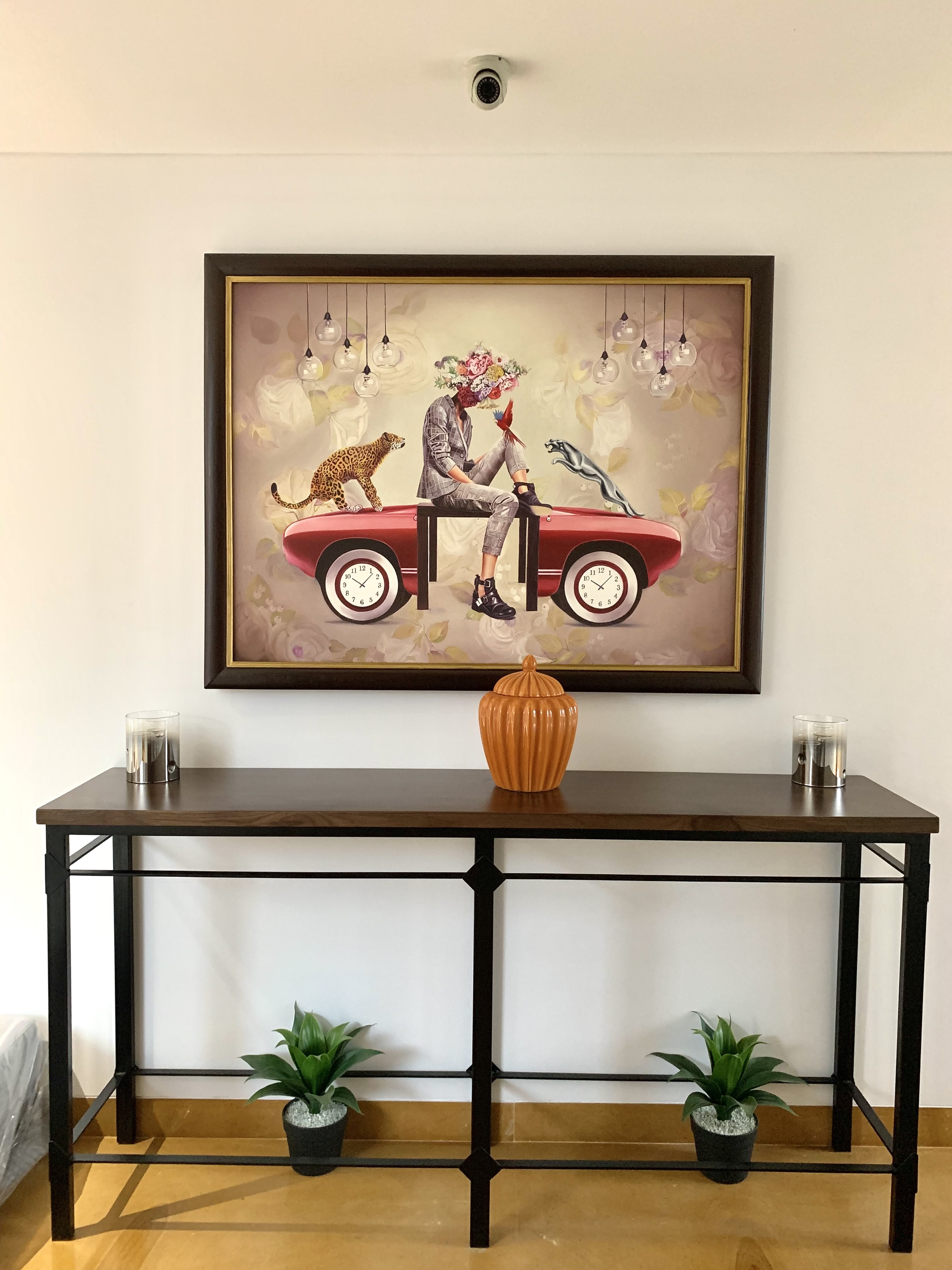 A residential living room with an abstract diptych above a cream sofa and Buddha statue — Artemist Consultancy, residential