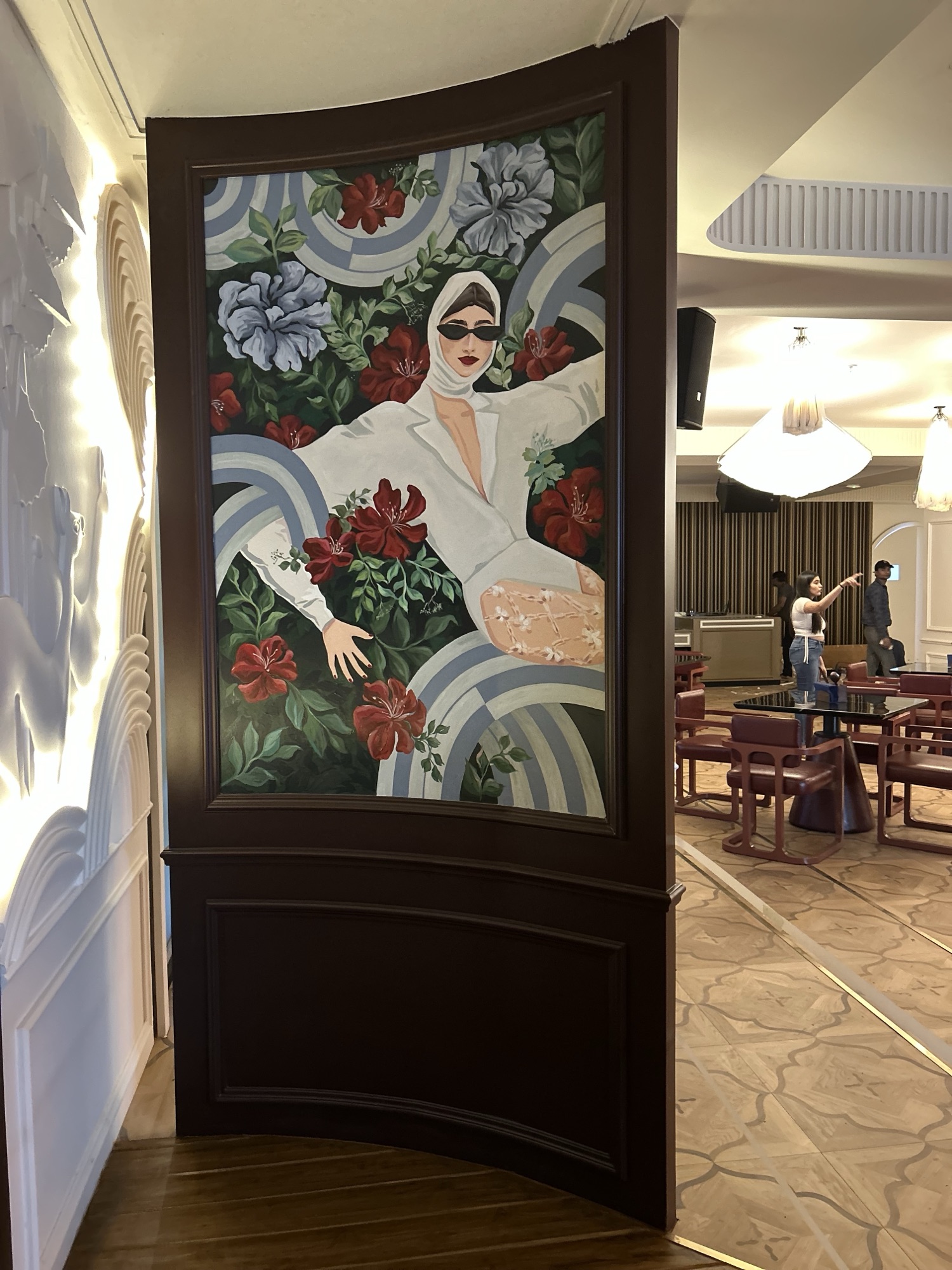 A hospitality space with artwork placed by The Artemist, Kolkata